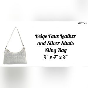 Beige sling bag with silver studs, dust cover, 9" x 4" x 3"